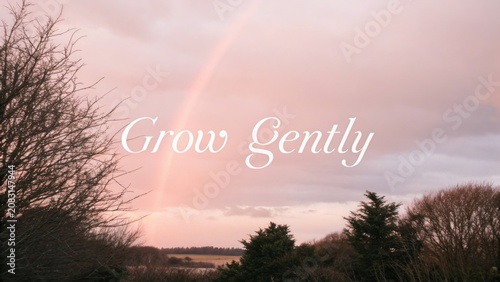 Serene Landscape with Soft Color Palette and Subtle Rainbow Over Tranquil Field Under Gentle Evening Sky