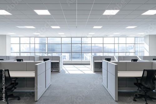 Modern, empty office cubicles with bright natural light flooding in