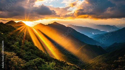 Stunning sunset casts golden rays over impressive mountain peaks creating a beautiful landscape