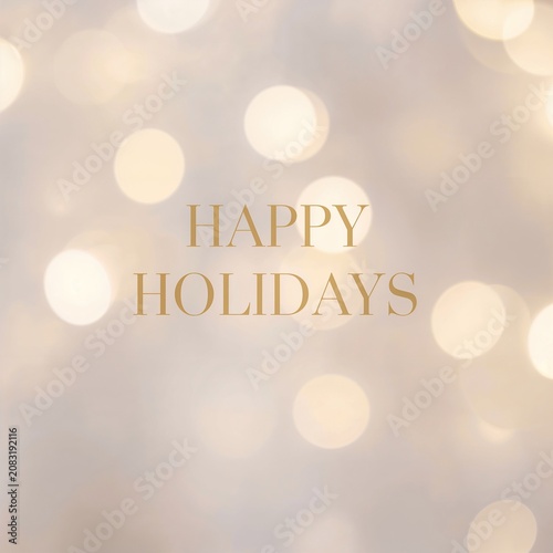 Warm bokeh lights surround the text Happy Holidays in elegant gold font. This image evokes a feeling of warmth, joy, and festive cheer, perfect for seasonal greetings and celebrations.
