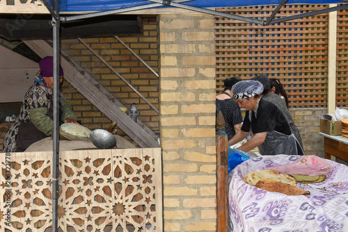 Womans cooking breads at Khiva in Uzbekistan