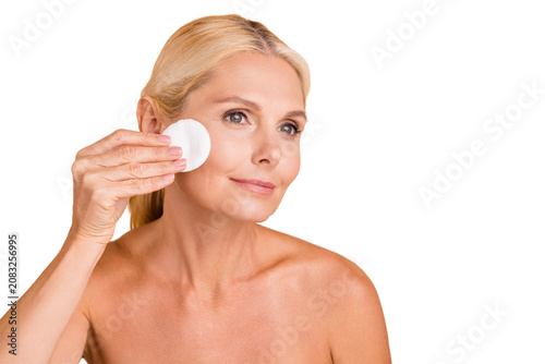 Billede på lærred Closeup photo of beautiful aged lady model hold cotton disc pad removing visage