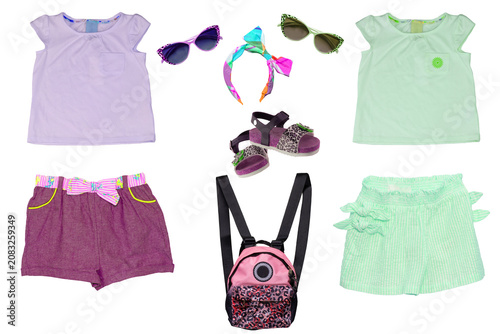 Collage set of little girl summer clothes isolated on white. Kids apparel collection. Childs fashion clothing outfit. Skirt, shorts, shirt, dresses, jeans, bag, sweater, shoes.