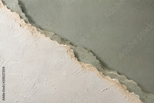 Abstract Layered Plaster Texture Background with Organic Torn Edge in Neutral Earth Tones