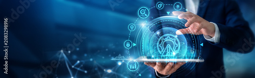Obraz na płótnie Risk manager using tab analysing Risk Management and compliance monitoring systems, threat assessment strategies, business continuity planning and governance controls