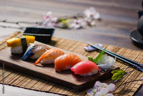 Obraz na płótnie Mix sushi on wood dish, tuna, salmon, sea bass, sweet egg, shrimp sushi, Japanes