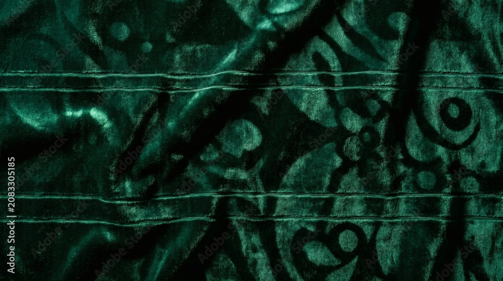 Obraz premium Dark abstract background with mysterious glowing green symbols and textured surface.