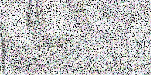 Textured abstract background with a multitude of small, light-colored dots on a dark surface pointillism