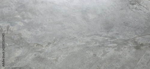Polished concrete walls or floors. A loft-style backdrop or architectural decorative surface. Features natural alternating patterns and shades of light and dark gray. Floor or wall industrial style 
