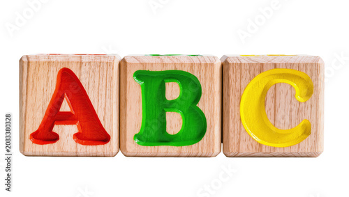 Fotografie Wooden alphabet blocks with letters A B C in red green, yellow