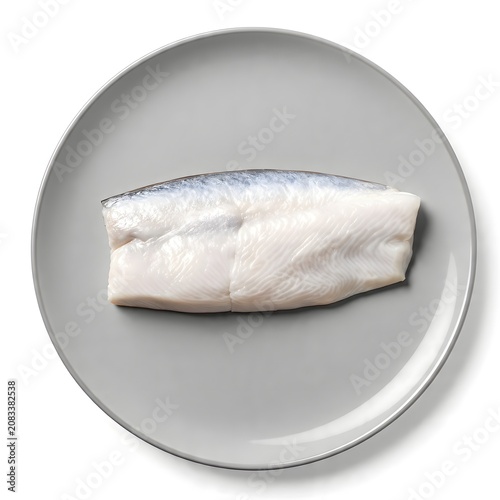 Raw Herring Fillet on Plate: A pristine, uncooked herring fillet, with its characteristic silver sheen and delicate flesh, rests on a minimalist grey plate, ready for culinary preparation.