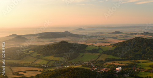 Картината върху платно Aerial Golden Hour Panorama of a Bohemian Village with a Grand Palace Nestled Am