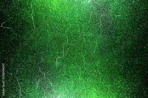 Green black glitter texture abstract banner background with space. Twinkling glow stars effect. Like outer space, night sky, universe. Rusty, rough surface, grain.