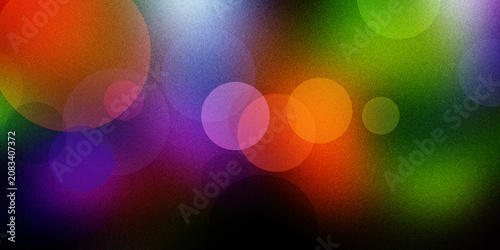 Foto Vibrant abstract background with colorful glowing bokeh circles and soft light particles on dark texture for creative design