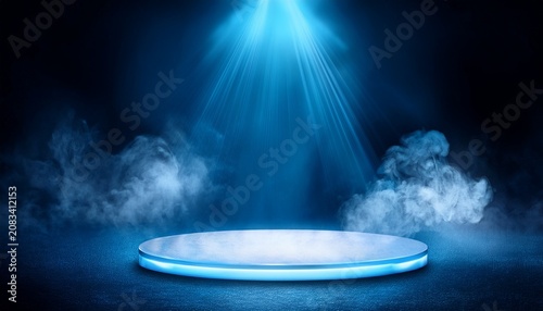 blue stage lights illuminating round platform with smoke effect