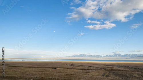 Εκτύπωση καμβά Serene blue high altitude salt lake reflecting a clear sky and distant mountains