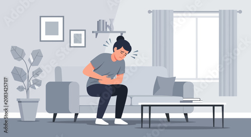 Person Experiencing Abdominal Distress While Sitting On A Couch