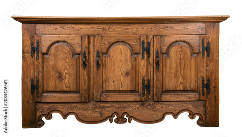 Antique wooden cabinet with three arched doors and ornate metal hardware