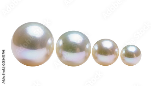 Schilderij op canvas Four lustrous pearls of varying sizes and iridescent sheen