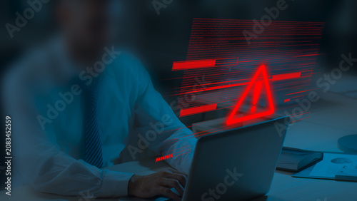 Red Cyber Security Warning Alert Symbol with Digital Glitch Interface, Man Working on Laptop Background, System Error, Data Breach, Malware Attack, Network Threat, Cyber Defense Technology Concept