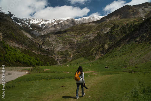 A young girl hiking alone in the Pyrenees, Pineta Valley, Monte Perdido, Camino de los Llanos de la Larri, Aragón, Huesca, Spain