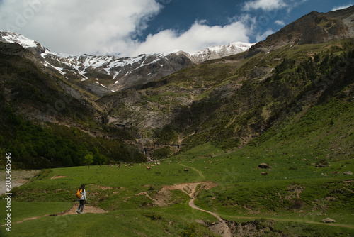 A young girl hiking alone in the Pyrenees, Pineta Valley, Monte Perdido, Camino de los Llanos de la Larri, Aragón, Huesca, Spain
