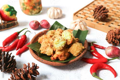 A plate of golden, batter‑fried cauliflower—crispy on the outside, tender and moist within.