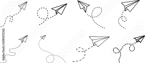 Фотография Set of simple paper plane icons with dashed flight paths on a transparent background