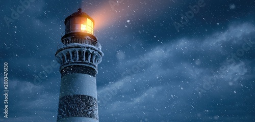 A snow-covered lighthouse illuminates the dark, stormy night sky