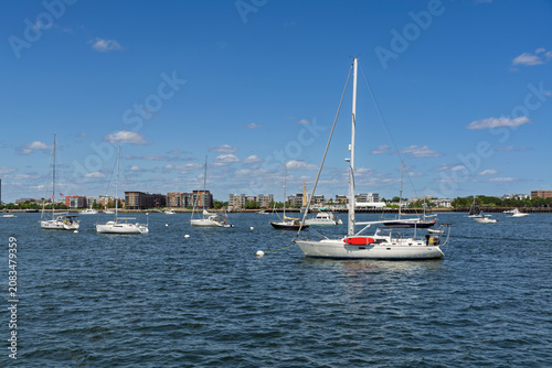 Sailboats anchored in the harbor at the Boston Navy Yard
