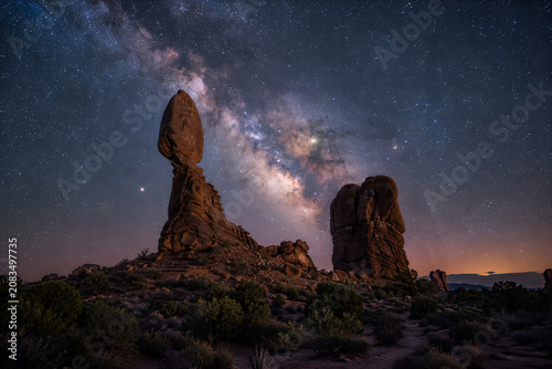 Balanced Rock Beneath the Milky Way in a Dramatic Desert Night Landscape