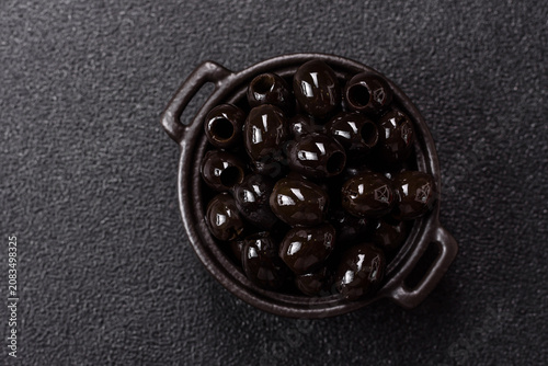 Black canned olives without pits for salads and snacks. Black olives without pits