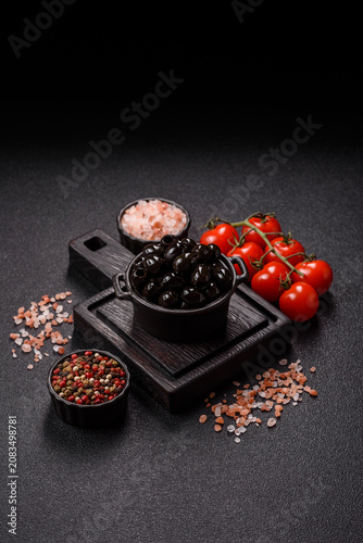 Obraz na płótnie Black canned olives without pits for salads and snacks