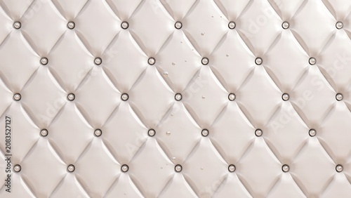 White tufted upholstery fabric with silver buttons closeup texture