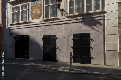 Historic building with dark shutters.