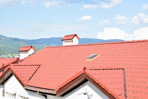 View of rooftops made of ceramic tiles in the mountains
