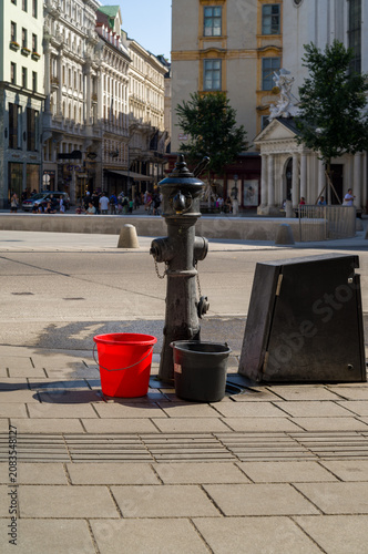 Fire hydrant and two buckets.