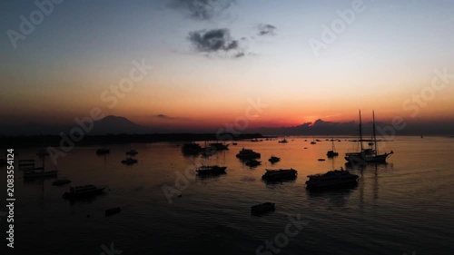 Bali Coastline at Sunrise with Numerous Boats and Calm Ocean - Drone View