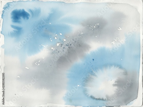 Abstract watercolor background, with soft blue, and grey washes, and fine splatter, texture on paper