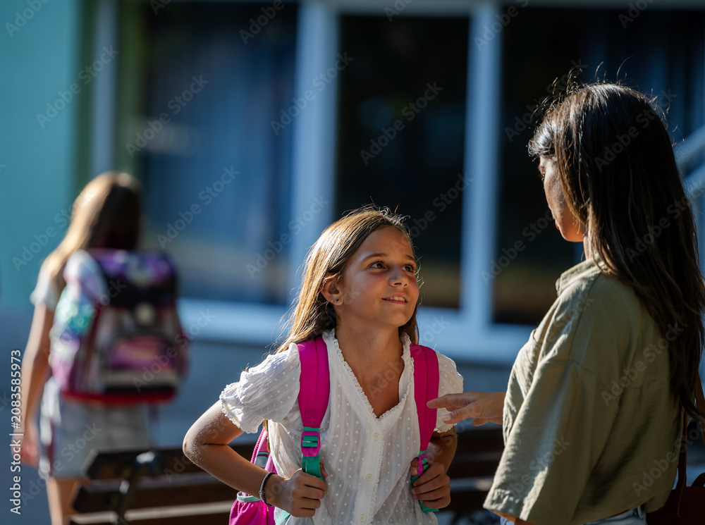 Fototapeta premium Mother is accompanying child to school