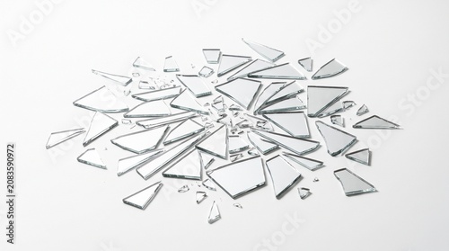 Shattered mirror glass shards, broken reflective glass pieces, sharp silver fragments of a destroyed mirror isolated PNG with Transparent Background