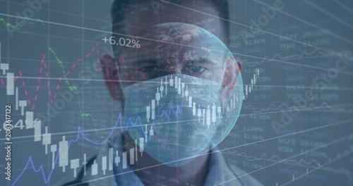 Masked doctor facing camera as health data feeding globe over mask and animating charts for finance