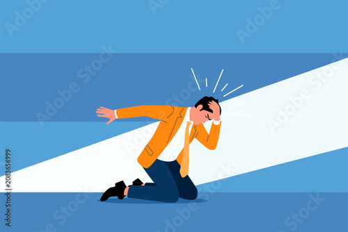 Εκτύπωση καμβά Despair in the Spotlight: A businessman kneels in defeat, clutching his head in despair as a harsh light shines down on his plight