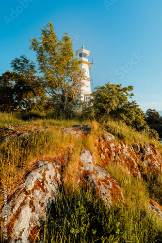 Photography Beautiful scenic view of Sweden landscape with traditional red houses