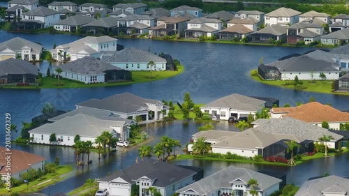 Flooded residential area with underwater houses from hurricane rainfall water in Florida suburban community. Aftermath of natural disaster in southern USA