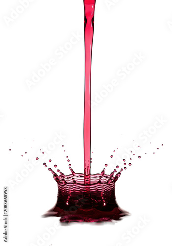deep ruby-red viscous liquid forms a symmetrical 'crown splash' with frozen micro-droplets against a transparent background, concept for scientific product visualization