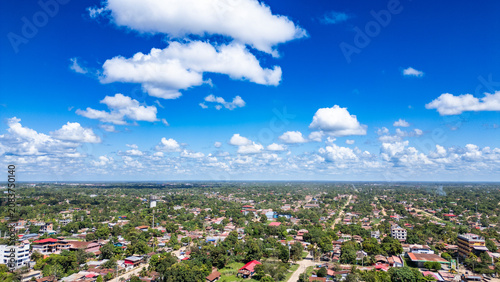 Принти на полотні Yarinacocha town grid blending into the vast Peruvian Amazon low jungle under a bright summer sky