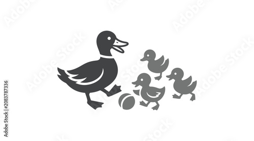 Obraz na plátně Mother duck with little ducklings walking.