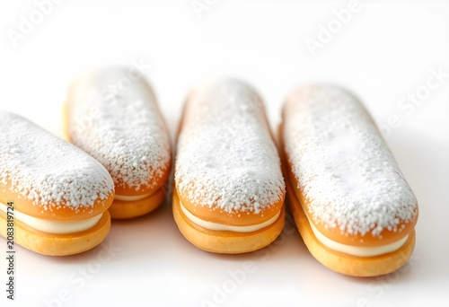 Five eclairs with powdered ...