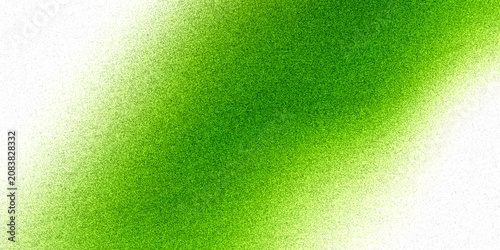 Vibrant green spray paint abstract texture on white background.